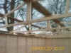 Roof trusses of a 16 ft wide garage during erection